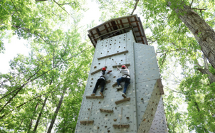 Rock climbing wall with climbers Rock climbing wall with climbers